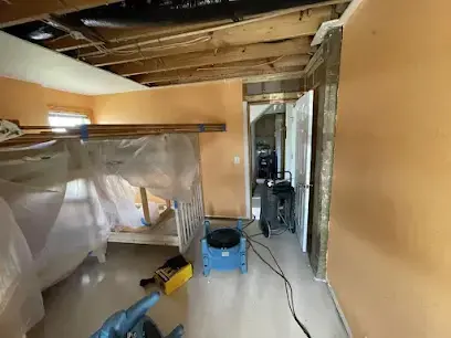 Containment plastic and drying equipment in a room with the ceiling opened in El Monte